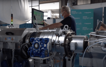 A Bausano Employee demonstrate an extrusion line